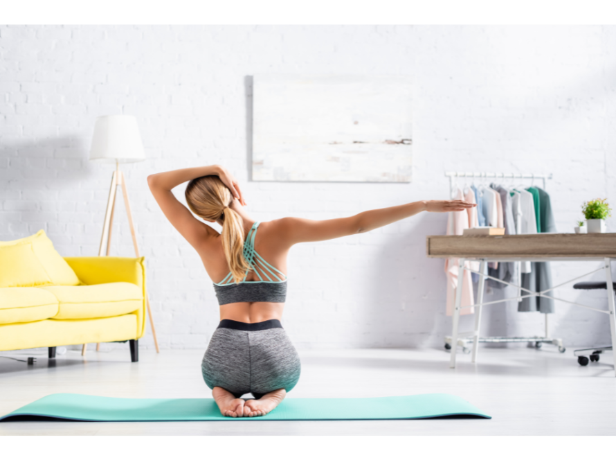 woman in clean living room doing lateral flexion neck stretch