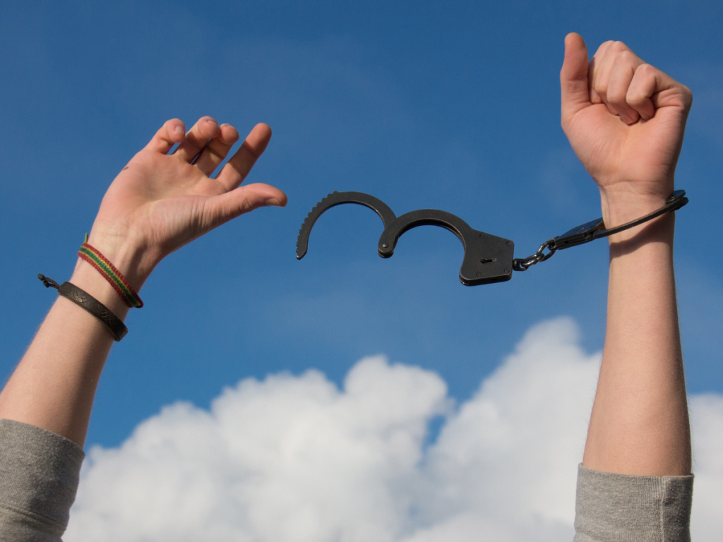 person's hands breaking out of handcuffs by learning how to decrease symptoms of stress